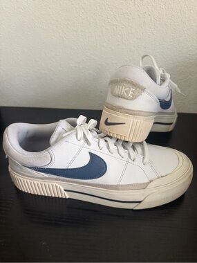 Retro Nike White Sneakers with Blue Swoosh